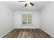 Comfortable bedroom with modern ceiling fan, wood-look flooring, and natural light at 231 Harris Rd, Smithfield, NC 27577