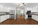 Modern kitchen with stainless steel appliances, white cabinets, and open floor plan at 231 Harris Rd, Smithfield, NC 27577