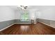 Open living room with hardwood floors, natural light, and soothing gray and white color scheme at 231 Harris Rd, Smithfield, NC 27577