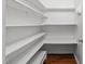 Pantry with white shelving and door access, ensuring tidy storage at 231 Harris Rd, Smithfield, NC 27577