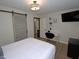Bedroom featuring modern decor, sleek desk area, and ample closet space at 2409 Derby Dr, Raleigh, NC 27610
