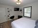 Well-lit bedroom with a desk, creating a functional and stylish workspace at 2409 Derby Dr, Raleigh, NC 27610