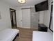 Shared bedroom featuring twin beds, barn door, and modern décor for a comfortable space at 2409 Derby Dr, Raleigh, NC 27610