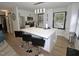 Modern kitchen with a large island, stainless steel appliances, and bright white cabinetry at 2409 Derby Dr, Raleigh, NC 27610