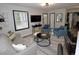 Open-concept living room boasting modern furnishings, stylish decor, and a seamless flow at 2409 Derby Dr, Raleigh, NC 27610