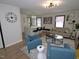 Inviting living room with modern decor, neutral walls, and wood-look floors that opens up to the kitchen at 2409 Derby Dr, Raleigh, NC 27610