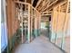 Unfinished home interior featuring exposed framework, open space, a window, and framed doorways ready for customization at 243 Steel Springs Ln # 25, Angier, NC 27501