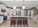 Well-equipped kitchen featuring modern appliances, a large island, and ample counter space for meal preparation at 243 Steel Springs Ln # 25, Angier, NC 27501