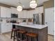 Modern kitchen with stainless steel appliances, white cabinets, and a center island with seating at 243 Steel Springs Ln # 25, Angier, NC 27501