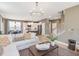 Spacious living room with open floor plan, leading to a modern kitchen with stainless steel appliances at 243 Steel Springs Ln # 25, Angier, NC 27501