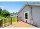 A wood deck attached to the house and a back door to the house at 2527 Ossipee Front St, Elon, NC 27244