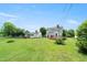 Spacious backyard with a wood deck connected to the house at 2527 Ossipee Front St, Elon, NC 27244