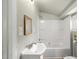 Well-lit bathroom featuring a vanity and a shower-tub combination at 2527 Ossipee Front St, Elon, NC 27244
