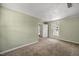 Well-lit bedroom with neutral paint and an open door to the hall at 2527 Ossipee Front St, Elon, NC 27244