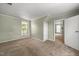 Bright bedroom with closet and window to backyard with tree views at 2527 Ossipee Front St, Elon, NC 27244