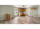 Well lit kitchen features wood cabinets, a window over the sink and wood laminate flooring at 2527 Ossipee Front St, Elon, NC 27244