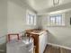 Laundry room with utility sink, two windows, and an AO Smith hot water heater at 2527 Ossipee Front St, Elon, NC 27244