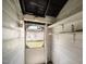Enclosed room with open shelves, a light fixture, and a door to the outside at 2527 Ossipee Front St, Elon, NC 27244