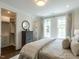Cozy primary bedroom with walk-in closet and natural light from two windows at 2656 Welham Aly, Raleigh, NC 27608