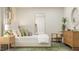 Serene bedroom featuring a stylish headboard, decorative pillows, and ample natural light at 2924 Ocean Sunrise Dr, Wake Forest, NC 27587