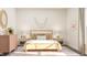 Cozy bedroom featuring a wooden bed frame, colorful pillows, and stylish decor at 2924 Ocean Sunrise Dr, Wake Forest, NC 27587