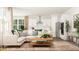 Bright living room featuring a stylish sectional sofa, hardwood floors, and modern decor, perfect for relaxation and entertaining at 2924 Ocean Sunrise Dr, Wake Forest, NC 27587