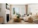 Elegant living room featuring a fireplace, large windows, comfortable seating, and chic decor, creating a warm and inviting atmosphere at 2924 Ocean Sunrise Dr, Wake Forest, NC 27587