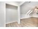 Well-lit attic space with laminate floors and closet access at 3306 Woodland Park Rd, Durham, NC 27703