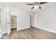 Spacious bedroom with wood-look floors and closet access at 3306 Woodland Park Rd, Durham, NC 27703