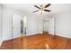 Bedroom featuring hardwood floors and multiple entry doors at 3306 Woodland Park Rd, Durham, NC 27703