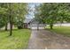 Charming two-story home with a two-car garage, and a landscaped front yard at 3306 Woodland Park Rd, Durham, NC 27703