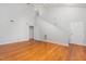 An open concept living room with hardwood flooring, neutral walls, and high ceilings at 3306 Woodland Park Rd, Durham, NC 27703