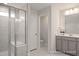 Modern bathroom featuring a glass enclosed shower with a built-in bench and vanity at 3916 Well Fleet Dr, Fuquay Varina, NC 27526