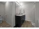 Updated bathroom with double vanity and modern fixtures, offering a clean and functional space at 4097 Cordiality Church Rd, Nashville, NC 27856