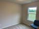 An inviting bedroom with natural light streaming through the window, and comfortable carpet at 4097 Cordiality Church Rd, Nashville, NC 27856