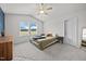 Bright bedroom with neutral tones, featuring a comfortable bed, ample natural light, and vaulted ceiling at 4097 Cordiality Church Rd, Nashville, NC 27856