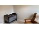 Bedroom featuring a Graco Pack 'n Play and a cozy recliner for relaxation at 4097 Cordiality Church Rd, Nashville, NC 27856