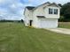 Inviting two-story home with a well-manicured lawn and attached two-car garage at 4097 Cordiality Church Rd, Nashville, NC 27856