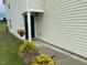 Exterior corner of home with landscaping, door with hanging flower basket at 4097 Cordiality Church Rd, Nashville, NC 27856