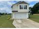 Charming two-story home featuring a spacious two-car garage and a paved driveway at 4097 Cordiality Church Rd, Nashville, NC 27856