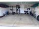 A spacious garage interior with ample room for vehicles, storage, and workout equipment at 4097 Cordiality Church Rd, Nashville, NC 27856