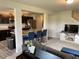 Inviting living room with a gray sofa, kitchen island with seating, and modern décor at 4097 Cordiality Church Rd, Nashville, NC 27856