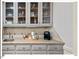 Cozy bar area featuring glass-front cabinets and ample counter space at 45 Birnham Ln, Durham, NC 27707