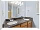 Bathroom features a double sink vanity with granite countertop, stylish fixtures, and modern mirrors at 45 Birnham Ln, Durham, NC 27707