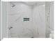 Modern bathroom featuring a stand-up shower with stunning marble tiling and a convenient built-in niche at 45 Birnham Ln, Durham, NC 27707
