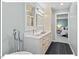 Bathroom featuring modern fixtures, double sinks, and access to the main bedroom, creating a spa-like experience at 45 Birnham Ln, Durham, NC 27707
