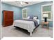 Stylish bedroom with a queen size bed, coordinating furniture, and plenty of natural light, offering a tranquil retreat at 45 Birnham Ln, Durham, NC 27707