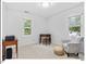 Cozy bedroom featuring two bright windows, a comfortable chair, and a desk, perfect for a home office or guest room at 45 Birnham Ln, Durham, NC 27707