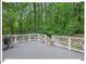 Inviting deck with grill, outdoor seating, and views of the lush green surroundings at 45 Birnham Ln, Durham, NC 27707