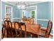 Stylish dining area featuring a classic wood table, modern light fixture, and access to other living spaces at 45 Birnham Ln, Durham, NC 27707